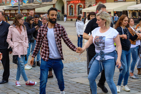 Wroclaw, Poland - April 2022: A lot of people dancing Rueda de Casino open event at market square