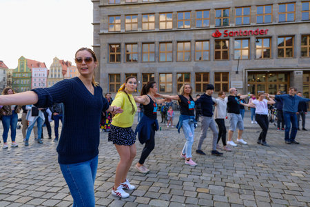 Wroclaw, Poland - April 2022: A lot of people dancing Rueda de Casino open event at market squareのeditorial素材