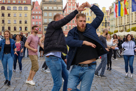 Wroclaw, Poland - April 2022: A lot of people dancing Rueda de Casino open event at market squareのeditorial素材