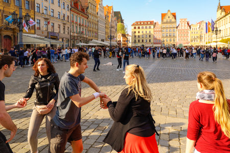 Wroclaw, Poland - April 2022: A lot of people dancing Rueda de Casino open event at market squareのeditorial素材