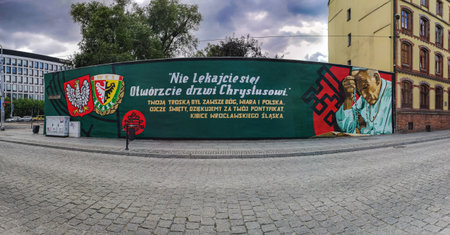 Wroclaw, Poland - August 2022: Long mural street art painting with Pope John Paul II and crest of Poland and Wroclaw football teamのeditorial素材