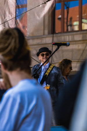 Wroclaw, Poland - May 1 2023: Artists and guitarists at main stage at open event Guitar Guinness World Record 2023 where record was beaten with 7967 guitars at market squareのeditorial素材