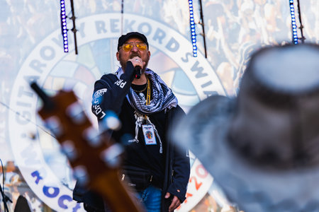 Wroclaw, Poland - May 1 2023: Artists and guitarists at main stage at open event Guitar Guinness World Record 2023 where record was beaten with 7967 guitars at market squareのeditorial素材