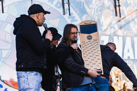 Wroclaw, Poland - May 1 2023: Artists and guitarists at main stage at open event Guitar Guinness World Record 2023 where record was beaten with 7967 guitars at market squareのeditorial素材