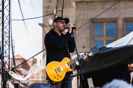 Wroclaw, Poland - May 1 2023: Artists and guitarists at main stage at open event Guitar Guinness World Record 2023 where record was beaten with 7967 guitars at market squareのeditorial素材