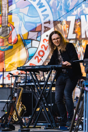 Wroclaw, Poland - May 1 2023: Artists and guitarists at main stage at open event Guitar Guinness World Record 2023 where record was beaten with 7967 guitars at market squareのeditorial素材