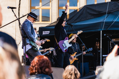 Wroclaw, Poland - May 1 2023: Artists and guitarists at main stage at open event Guitar Guinness World Record 2023 where record was beaten with 7967 guitars at market squareのeditorial素材