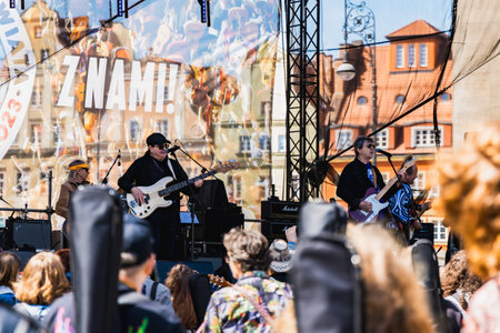 Wroclaw, Poland - May 1 2023: Artists and guitarists at main stage at open event Guitar Guinness World Record 2023 where record was beaten with 7967 guitars at market squareのeditorial素材