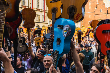 Wroclaw, Poland - May 1 2023: Participants with guitars and observing people around open event...