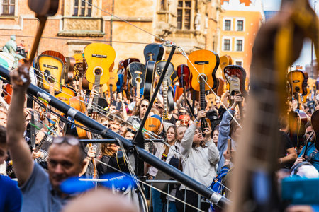 Wroclaw, Poland - May 1 2023: Participants with guitars and observing people around open event...