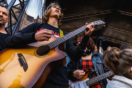 Wroclaw, Poland - May 1 2023: Participants with guitars at open event Guitar Guinness World Record...