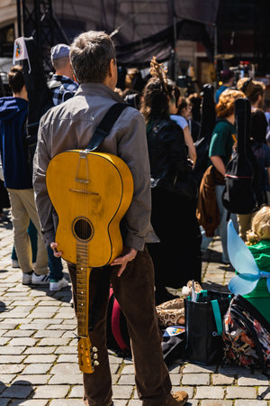 Wroclaw, Poland - May 1 2023: Participants with guitars at open event Guitar Guinness World Record...
