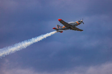 Leszno, Poland - June 16 2023: Antidotum Airshow Leszno 2023 and acrobatic shows of PZL-130 Orlik training plane on blue cloudy skyのeditorial素材