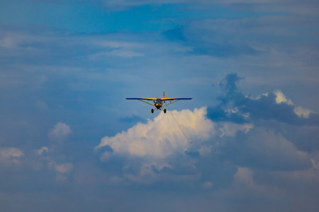 Leszno, Poland - June 16 2023: Antidotum Airshow Leszno 2023 and acrobatic shows of Lukasz Czepiela in Carbon Cub UL plane flying on a cloudy skyのeditorial素材