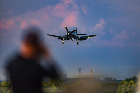 Leszno, Poland - June 16 2023: Antidotum Airshow Leszno 2023 and acrobatic shows full of smoke of Red Bull F4U Corsair on a cloudy skyのeditorial素材