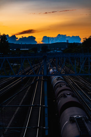 Beautiful view to cloudy sunset with beautiful golden sky and blue clouds seen from high footbridge...
