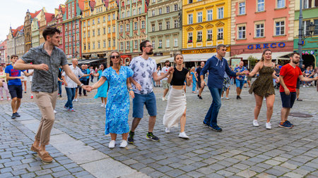 Wroclaw, Poland - July 2 2023: A lot of people dancing Rueda de Casino open event at market square