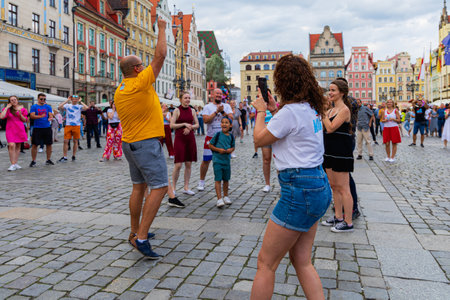 Wroclaw, Poland - July 2 2023: A lot of people dancing Rueda de Casino open event at market squareのeditorial素材