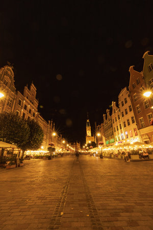 Gdansk, Poland - September 7 2023: Beautiful night cityscapes of streets and buildings of Gdansk...