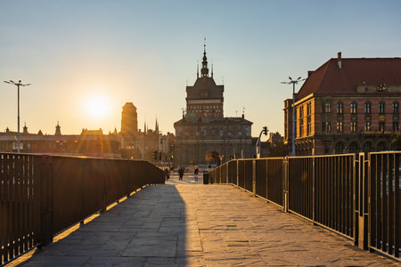 Gdansk, Poland - September 6 2023: Beautiful view to morning sunrise with shining sun over old...
