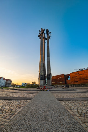 Gdansk, Poland - September 7 2023: Beautiful and tall monument to the Fallen Shipyard Workers 1970 standing in front of European Solidarity Center building at shipyardのeditorial素材