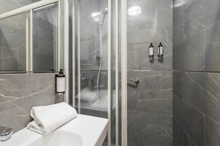 Gdansk, Poland - September 6 2023: Interior of hotel room for single and toilet of Impresja 3 star hotel at Aniolki district of Gdansk cityのeditorial素材