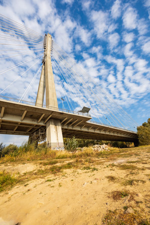 Warsaw, Poland - October 14 2023: Beautiful and big Swietokrzyski road bridge cable-stayed, put into operation in 2000, with lanes for pedestrians and cyclists on both sides of the structureのeditorial素材