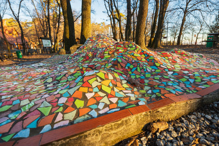 Sobotka, Poland - January 29 2024: Beautiful colorful mosaic construction with massif of Sleza mountains below the mountain at crossing of trailsのeditorial素材