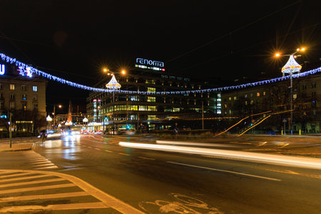 Wroclaw, Poland - December 17 2024: Long exposure night view of Renoma shopping mall at Kosciuszki Square in Wroclaw Poland with vibrant traffic light trailsのeditorial素材