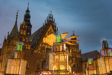 Wroclaw, Poland - January 6 2025: Festive Christmas Market in Wroclaw Poland with Traditional Wooden Stalls and Holiday Lights in the Historic Old Town Squareのeditorial素材
