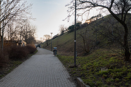 Wroclaw, Poland - February 9 2025: Modern Pedestrian Sidewalk and Bike Path with Street Lanterns and...