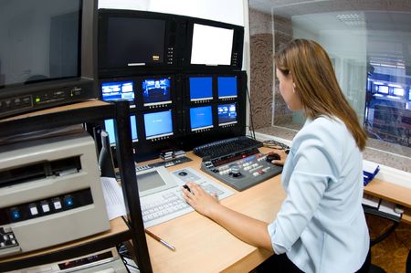 female TV director at editor in studio