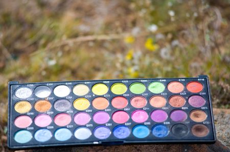 many-coloured eye shadows palette in shallow DOFの写真素材
