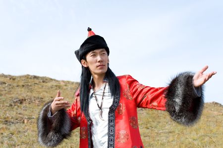 young asian man in national Mongolian suitの写真素材