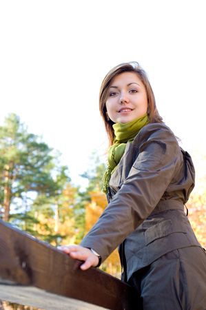 young beautiful european girl in autumn forestの写真素材