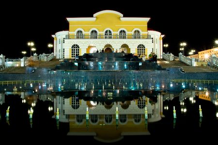 theatre building with stepped fountain in front at nightの写真素材