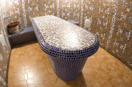 spa mosaic table with bench, sink and tapの写真素材