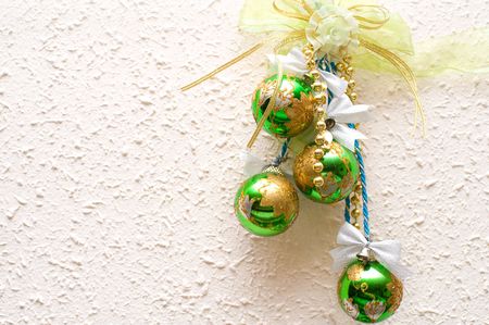 christmas green balls on wall with copy spaceの写真素材