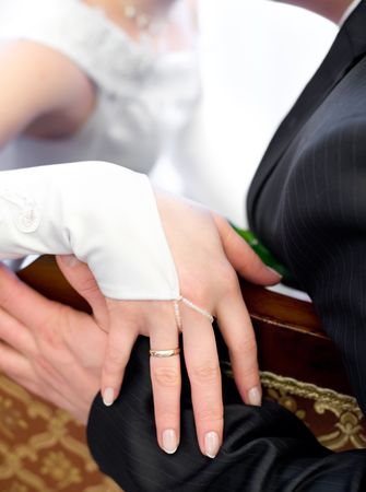 bride and groom close to each other, focus on handsの写真素材