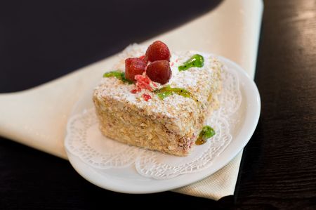 napoleon cake with three strawberries on top and green jellyの写真素材