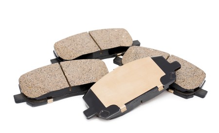 a full set of brake pads over white backgroundの写真素材