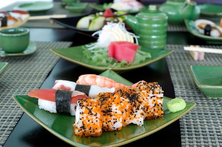 a laid table at a Japanese sushi restaurantの写真素材