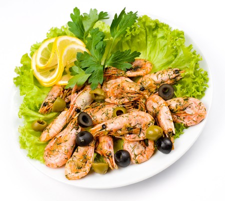 fried shrimps seasoned with olives and dillの写真素材