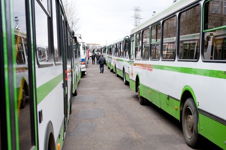 ULAN-UDE, RUSSIA - MAY 9: Buses are ready to bring war veterans after the parade to the place of...