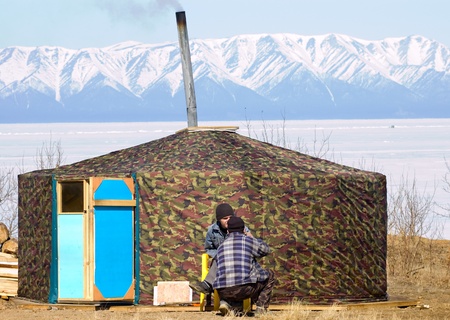 UST-BARGUZIN, RUSSIA - APRIL 10:  The 5th Annual Baikal Fishing. It is a cafe in a yurta covered with camouflage, April 10, 2009 in Ust-Barguzin, Buryatia, Russia.のeditorial素材