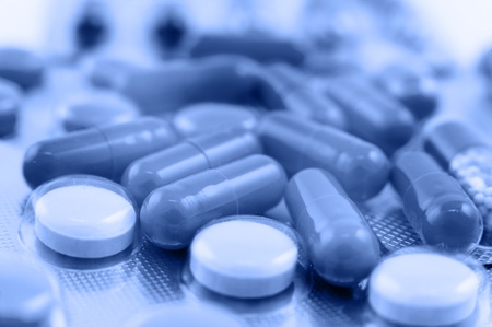 a macro shot of medicines, capsules and tablets, blue toningの写真素材