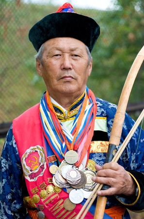 ULAN-UDE, RUSSIA - JULY 16: The 4th General Session of the World Mongolians Convention, July 16, 2010 in Ulan-Ude, Buryatia, Russia. An unidentidied participant in the Mongolian archery competition. のeditorial素材
