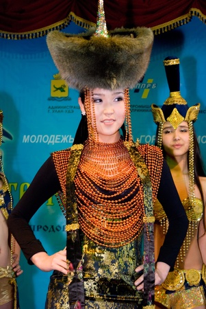 ULAN-UDE, RUSSIA - MARCH 25: A model wears a fancy dress in Mongolian ethnic style at the City Maecenas Ball on March, 25, 2009 in Ulan-Ude, Buryatia, Russia.のeditorial素材
