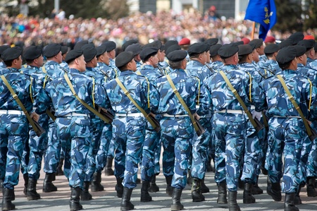 ULAN-UDE, RUSSIA - MAY 9: A special police squad marches at the parade on annual Victory Day, back...