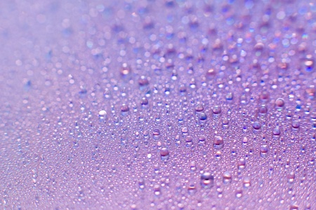 a lot of water drops over compact disk surface